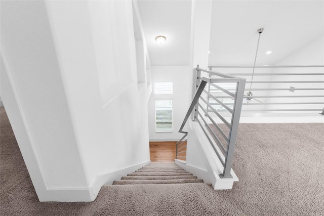 2211 Capulet St, Austin, TX 78741 - stairway featuring carpet flooring
