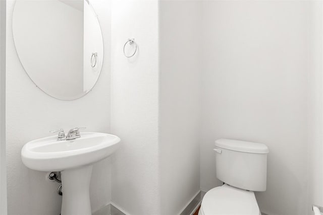 2211 Capulet St, Austin, TX 78741 - half bath with toilet and a sink