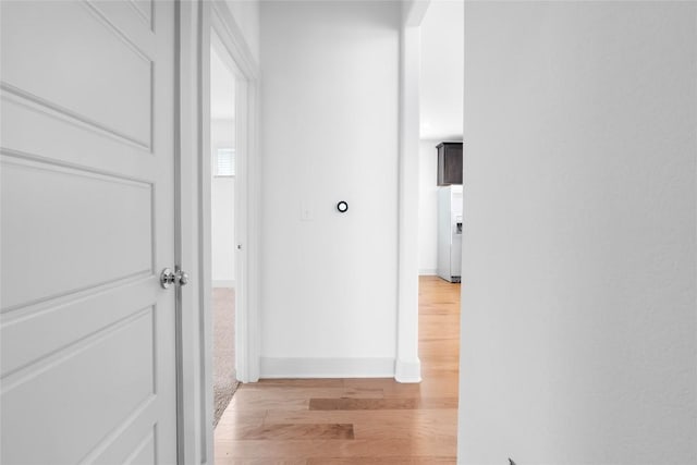 2211 Capulet St, Austin, TX 78741 - corridor with light wood-style floors and baseboards