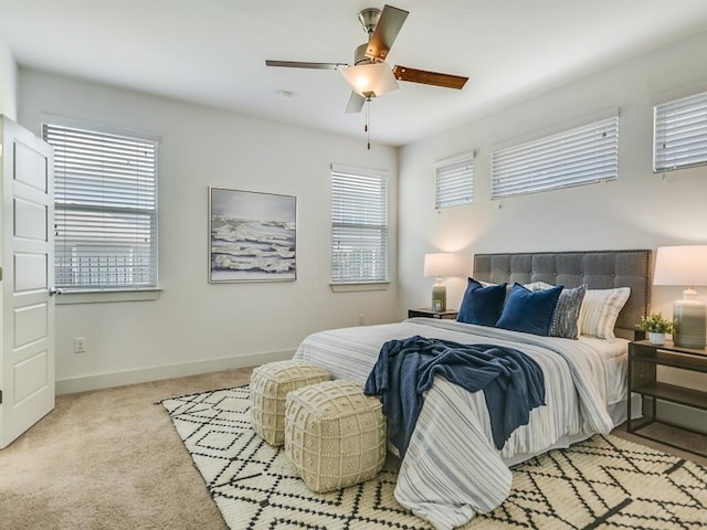 2211 Capulet St, Austin, TX 78741 - bedroom with carpet, baseboards, and a ceiling fan