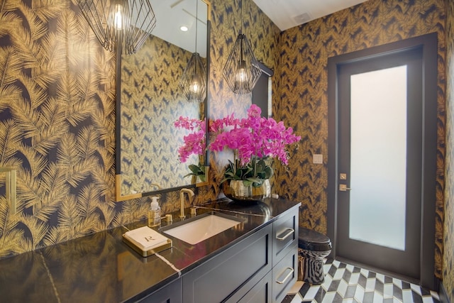 12885 Park Dr, Austin, TX 78732 - bathroom featuring wallpapered walls, vanity, and toilet