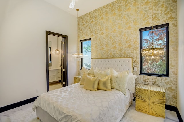 12885 Park Dr, Austin, TX 78732 - bedroom featuring wallpapered walls, baseboards, and connected bathroom
