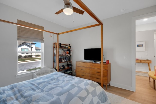 bedroom featuring ceiling fan and light wood-type flooring