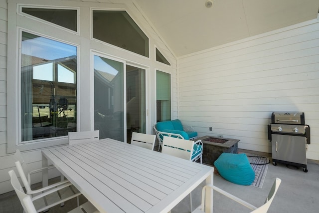 view of patio featuring a grill and a fire pit