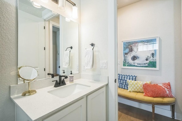 bathroom with vanity and hardwood / wood-style floors