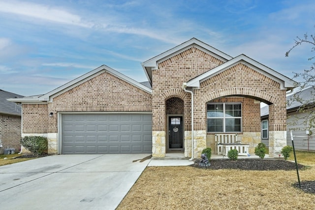 view of front of house with a garage and a front lawn