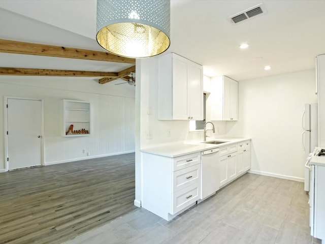 kitchen featuring ceiling fan, dishwasher, sink, and white cabinets