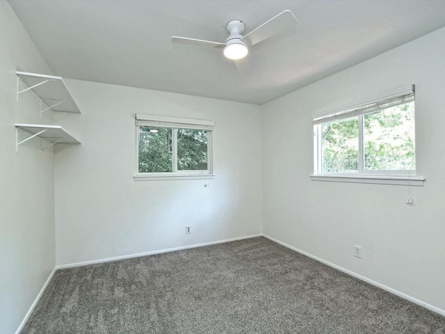 carpeted empty room with ceiling fan