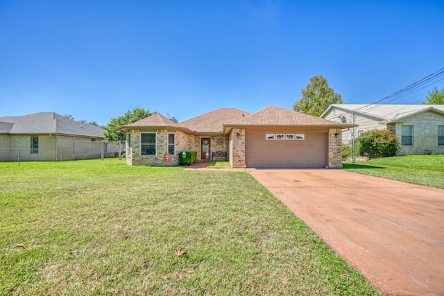 ranch-style house featuring a garage and a front yard