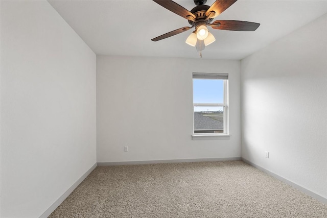 unfurnished room with ceiling fan and carpet flooring