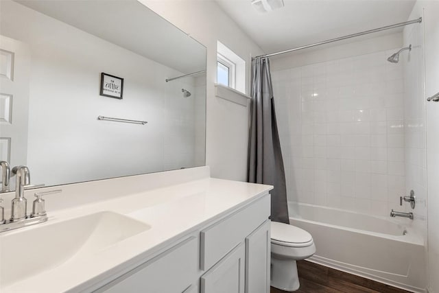 116 Big Cypress Bayou Rd, Hutto, TX 78634 - bathroom featuring toilet, wood finished floors, shower / bath combo with shower curtain, and vanity