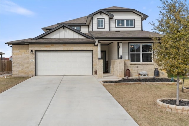 view of front of home featuring concrete driveway, a shingled roof, board and batten siding, and an attached garage