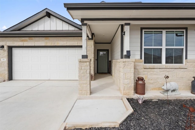 116 Big Cypress Bayou Rd, Hutto, TX 78634 - view of front facade with board and batten siding, stone siding, driveway, and a garage
