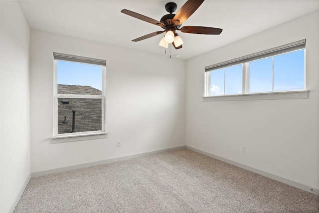 carpeted empty room with ceiling fan