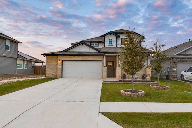 view of front facade with a garage, fence, concrete driveway, a lawn, and board and batten siding