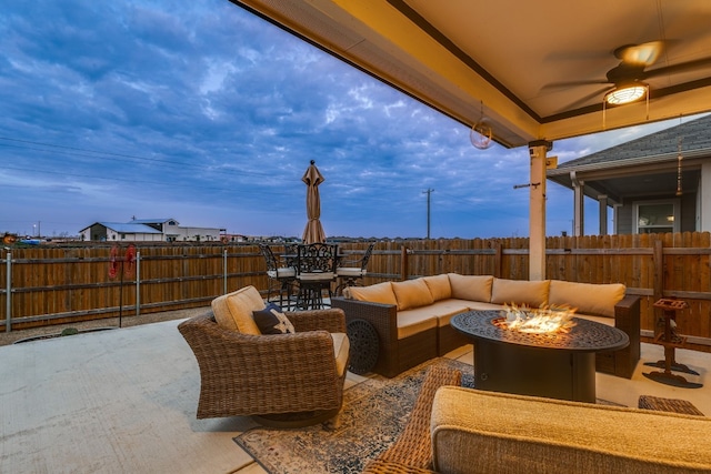 view of patio featuring an outdoor living space with a fire pit and ceiling fan