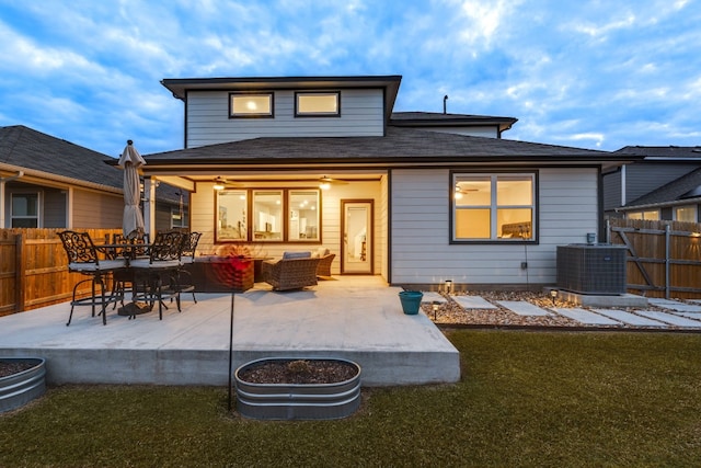 rear view of house featuring a patio, central AC unit, fence, and a ceiling fan