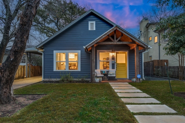 bungalow-style house with a lawn