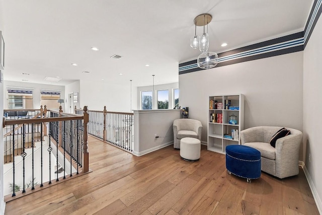 sitting room with light hardwood / wood-style floors