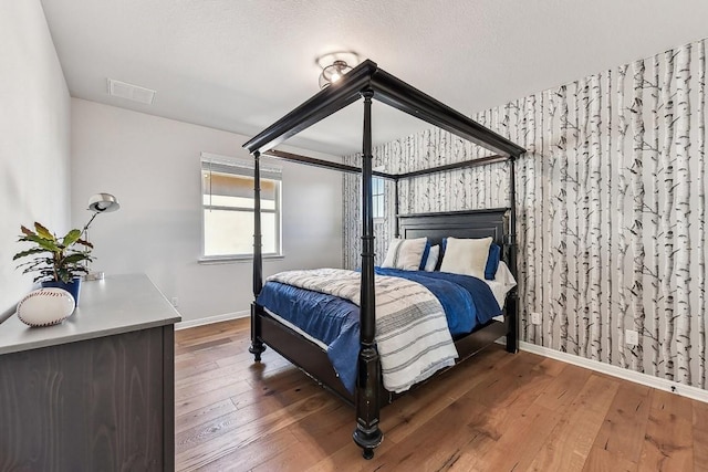 bedroom featuring dark hardwood / wood-style flooring