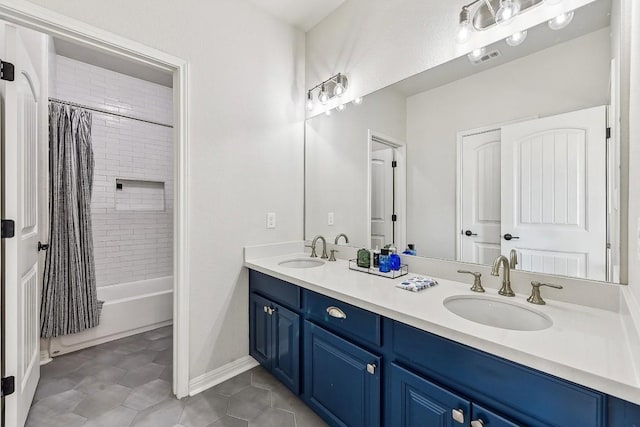 bathroom with tile patterned floors, vanity, and shower / tub combo