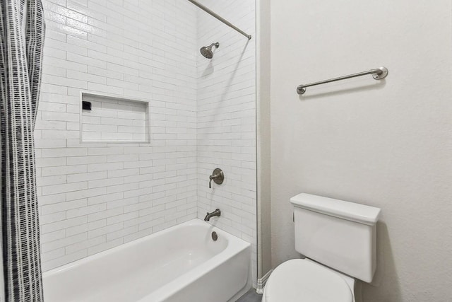 bathroom with toilet and shower / bath combo