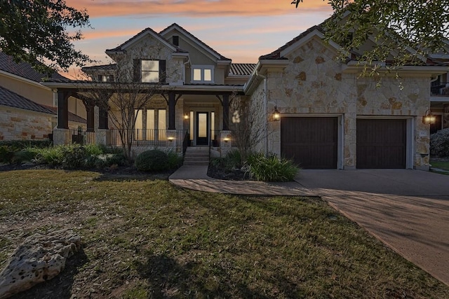 view of front of property with a lawn and a porch