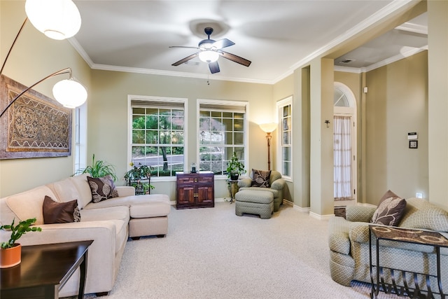 living room featuring ornamental molding, carpet floors, and ceiling fan