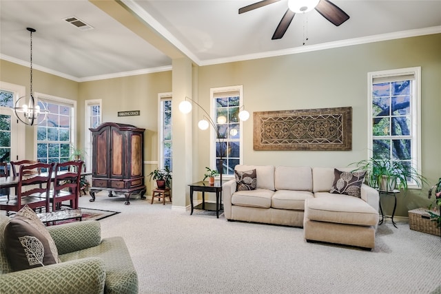 living room featuring crown molding, ceiling fan with notable chandelier, and carpet floors