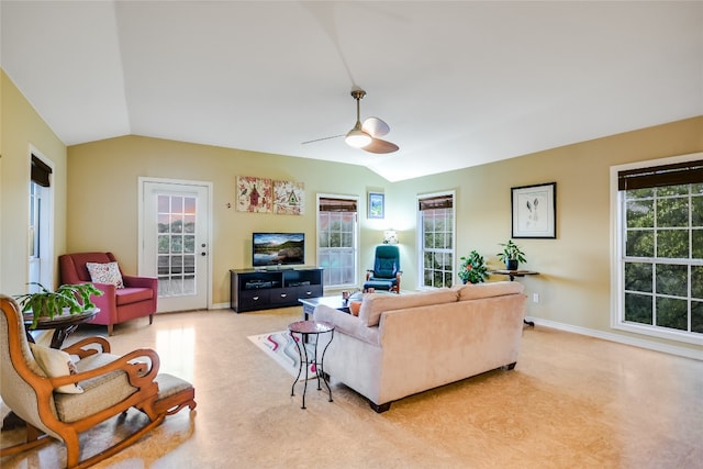 living room featuring ceiling fan and vaulted ceiling