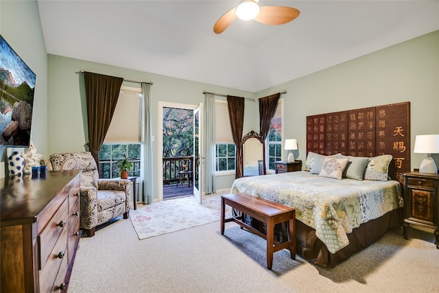 bedroom with multiple windows, light colored carpet, access to exterior, and ceiling fan