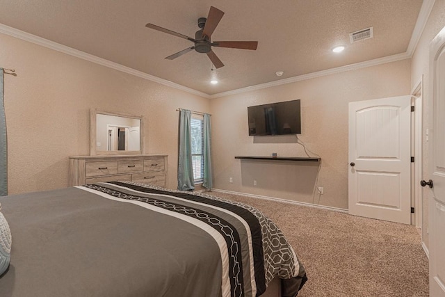 carpeted bedroom with ceiling fan, ornamental molding, and a textured ceiling