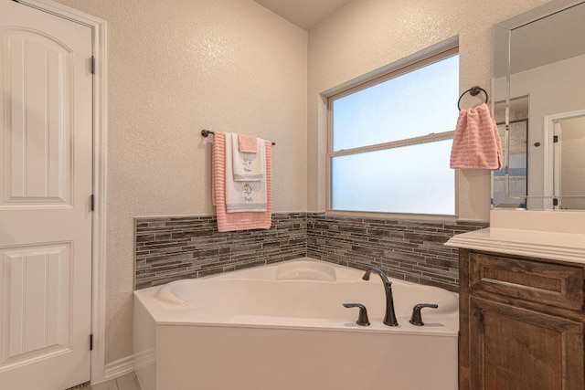 bathroom featuring vanity and a bathing tub