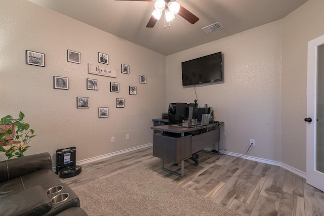 office featuring ceiling fan and light hardwood / wood-style floors