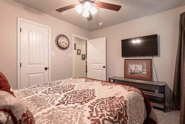 carpeted bedroom with ceiling fan