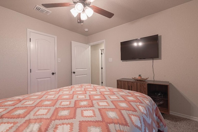 bedroom with ceiling fan and carpet floors