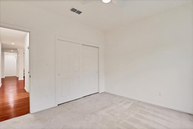 136 Clubhouse Dr, Lakeway, TX 78734 - unfurnished bedroom with carpet floors, a closet, and a ceiling fan