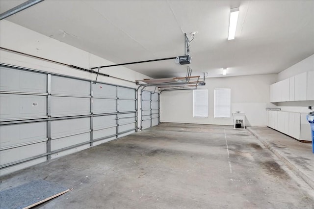 136 Clubhouse Dr, Lakeway, TX 78734 - garage featuring a garage door opener and a sink