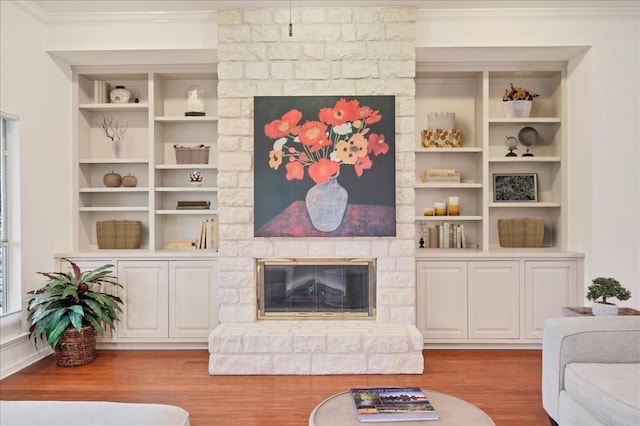 136 Clubhouse Dr, Lakeway, TX 78734 - living room featuring a fireplace, ornamental molding, wood finished floors, and built in shelves