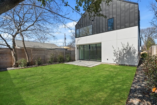 2903 E 14th St Unit 1, Austin, TX 78702 - rear view of house featuring board and batten siding, a patio area, and a balcony