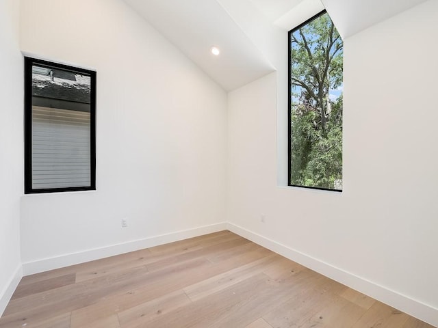 2903 E 14th St Unit 1, Austin, TX 78702 - spare room with baseboards, light wood-type flooring, and lofted ceiling