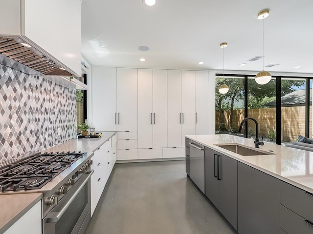 2903 E 14th St Unit 1, Austin, TX 78702 - kitchen with appliances with stainless steel finishes, a sink, decorative backsplash, finished concrete flooring, and modern cabinets