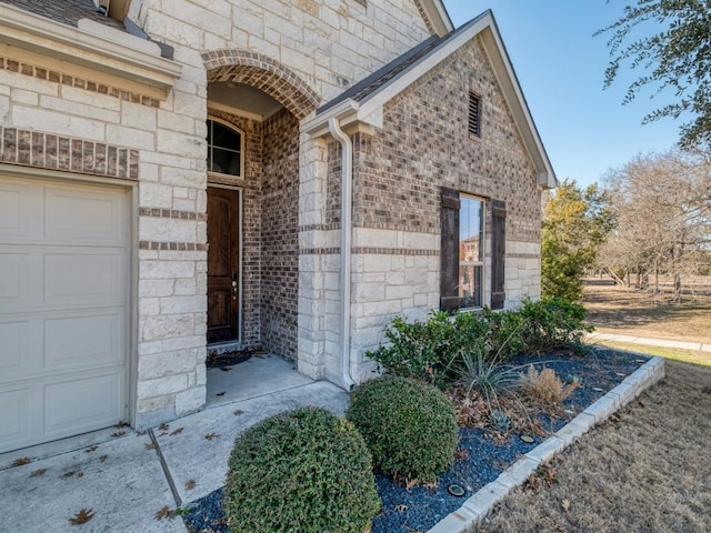 property entrance with a garage