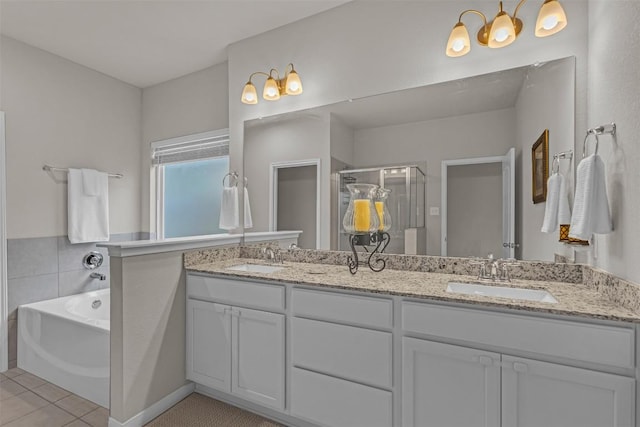 2221 Clove Ct, Temple, TX 76501 - bathroom with vanity, tile patterned floors, and separate shower and tub