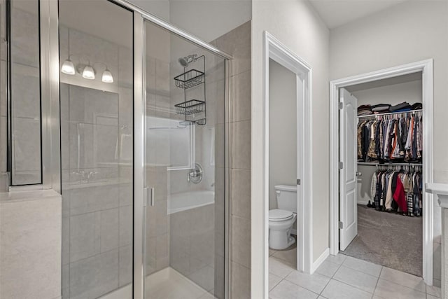 2221 Clove Ct, Temple, TX 76501 - bathroom with a shower with door, tile patterned floors, and toilet