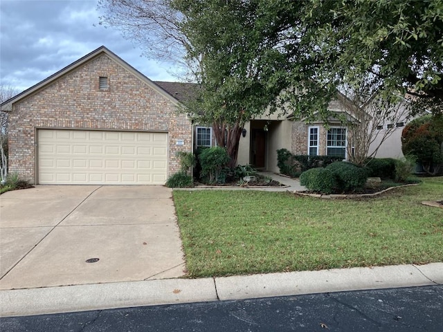 view of front facade with a garage and a front lawn