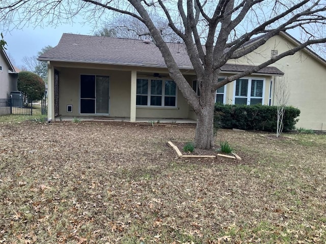 103 Wild Rose Dr, Georgetown, TX 78633 - back of house featuring stucco siding, central AC unit, and a shingled roof