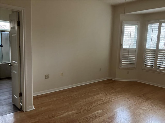 103 Wild Rose Dr, Georgetown, TX 78633 - spare room featuring wood finished floors and baseboards