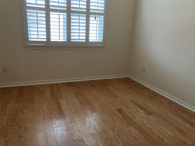 103 Wild Rose Dr, Georgetown, TX 78633 - empty room with wood finished floors and baseboards