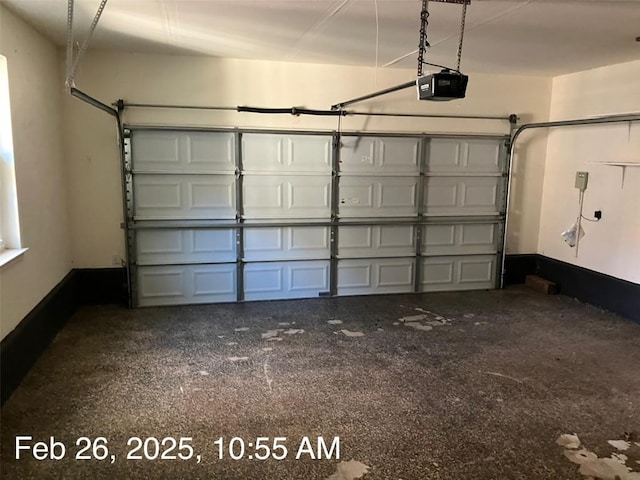 103 Wild Rose Dr, Georgetown, TX 78633 - garage with a garage door opener and baseboards
